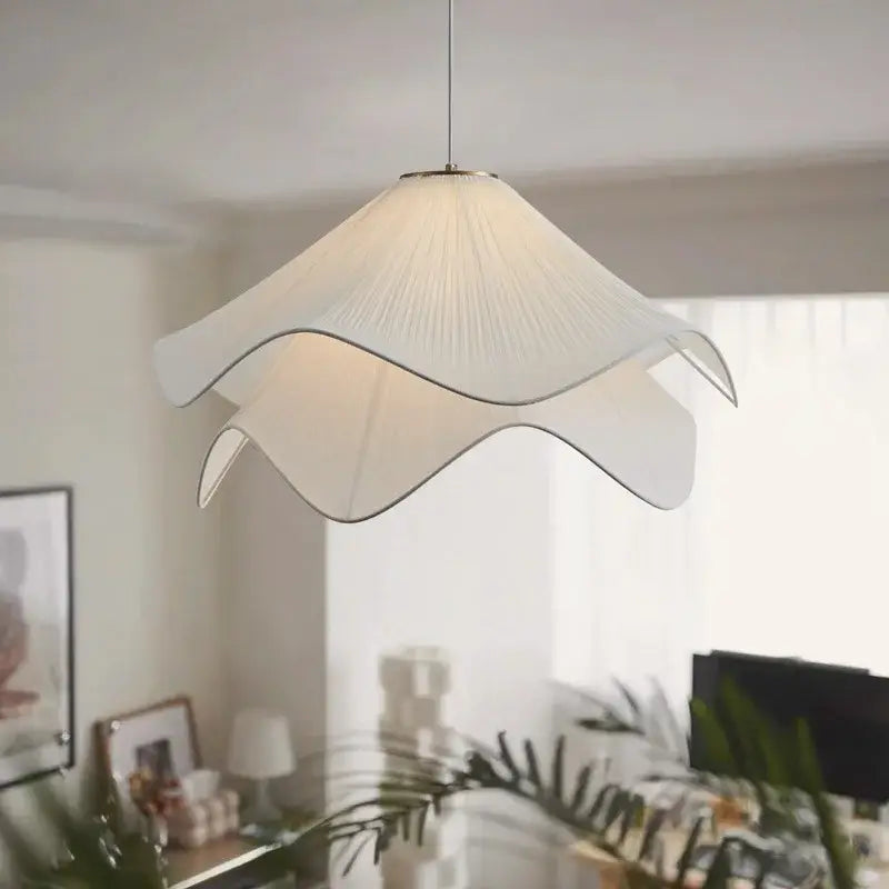 Layered white fabric pendant light with pleated petal-shaped shade and metallic trim for dining room decorbites led white