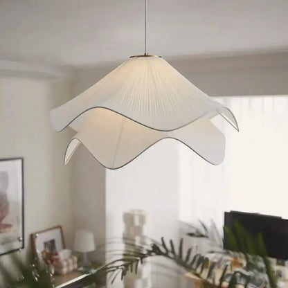 Layered white fabric pendant light with pleated petal-shaped shade and metallic trim for dining room decorbites led white