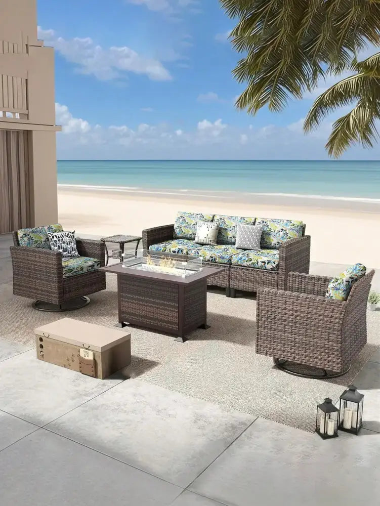 Brown wicker outdoor patio set with tropical leaf pattern brushed knit sofa cushion covers and fire pit table