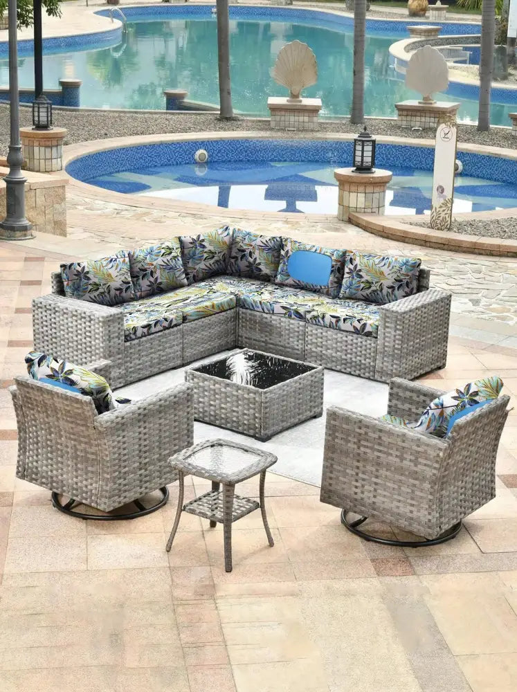 Gray wicker patio sectional set with tropical leaf pattern brushed knit outdoor sofa cushion covers and coffee table