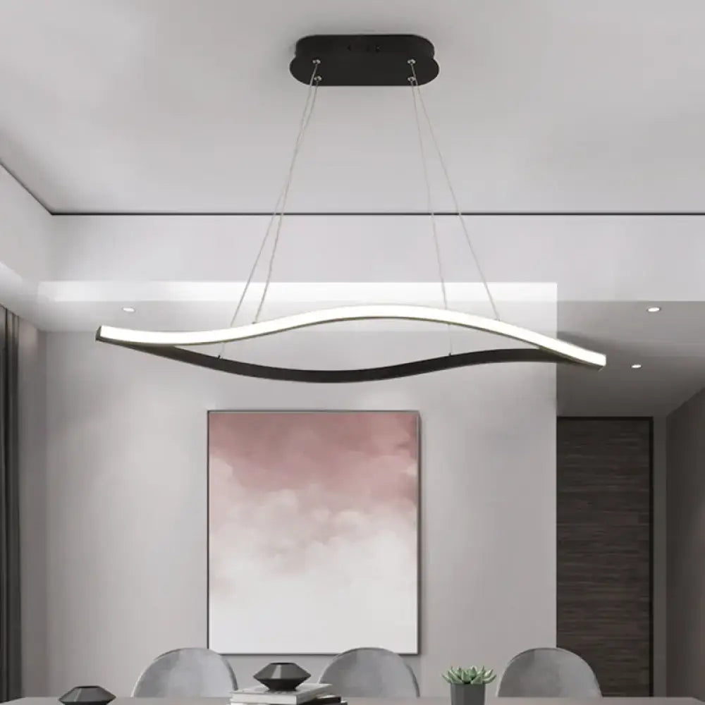 Modern black and white led island lamp with sleek curved design and black leaf frame in warm color temperature hanging from ceiling