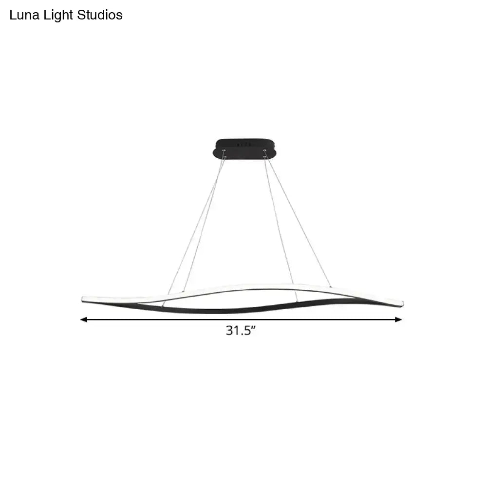 Modern black and white led island lamp with a sleek curved design and black leaf frame in warm color temperature