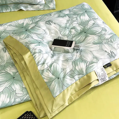 A light green satin duvet cover with white floral pattern and yellow border complementing decorbites leopard print pillow sham