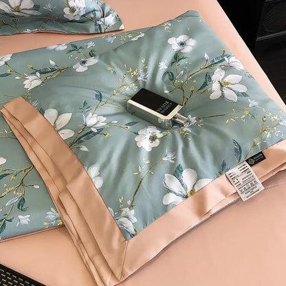 A soft sage green pillowcase with white floral embroidery and peach satin border in decorbites leopard print summer style bedroom decor