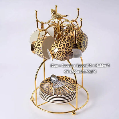Gold-toned porcelain leopard print coffee set with matching spoons on tiered stand for decorbites leopard print decor