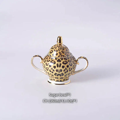 Leopard print ceramic sugar bowl with gold accents and handles from decorbites leopard print coffee set dining room decor