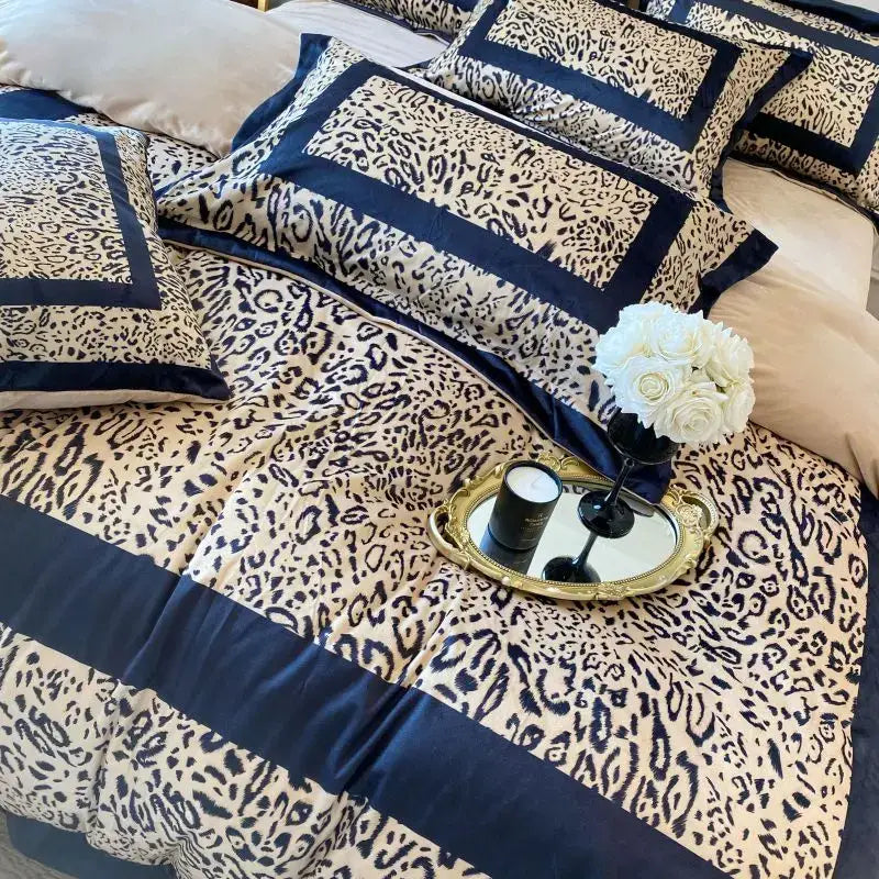 Cream-colored and navy blue leopard print velvet bedding set with satin trim for decorbites leopard print bedroom decor