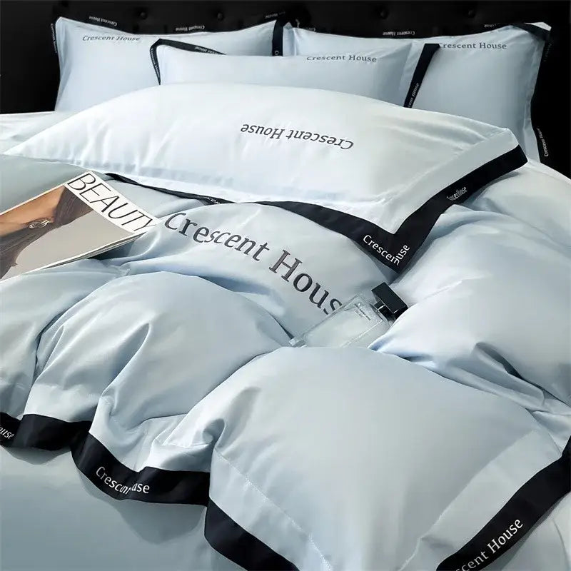 Light blue and black ice silk duvet cover bed set with crescent house branding by decorbites for bedroom use