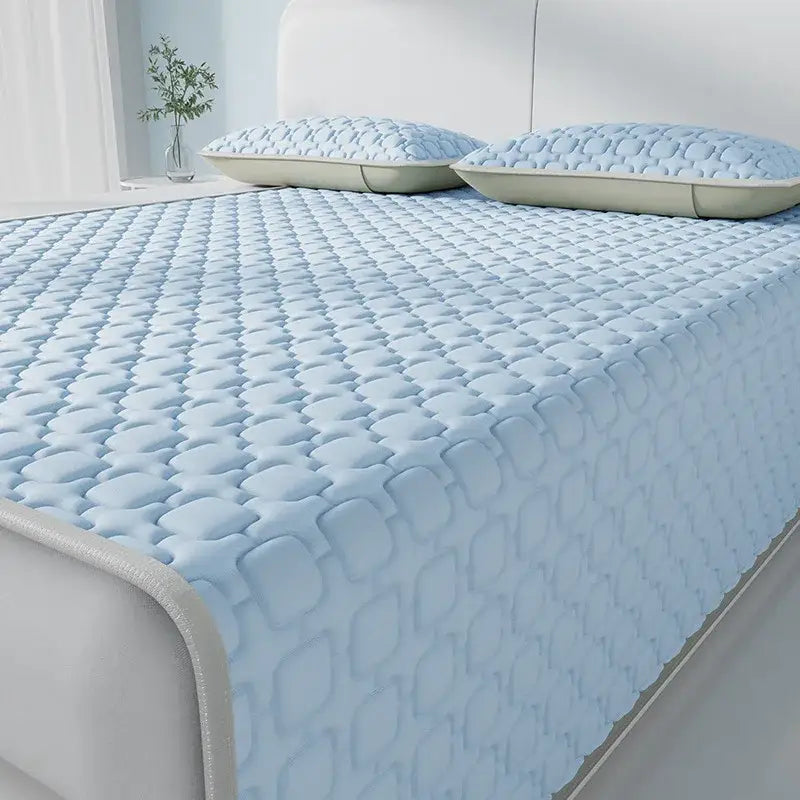 Light blue and beige quilted mattress pad with cooling latex pad feature and subtle diamond pattern by decorbites cooling latex