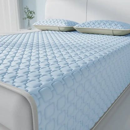 Light blue and beige quilted mattress pad with cooling latex pad feature and subtle diamond pattern by decorbites cooling latex