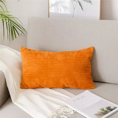 Vibrant orange corduroy flocking pillow cover resting on light gray sofa decorbites corduroy flocking for living room decor