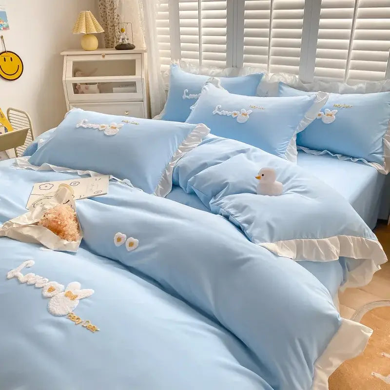 Light blue cotton bedding set with white ruffled edges and decorbites cartoon embroidery for bedroom decor
