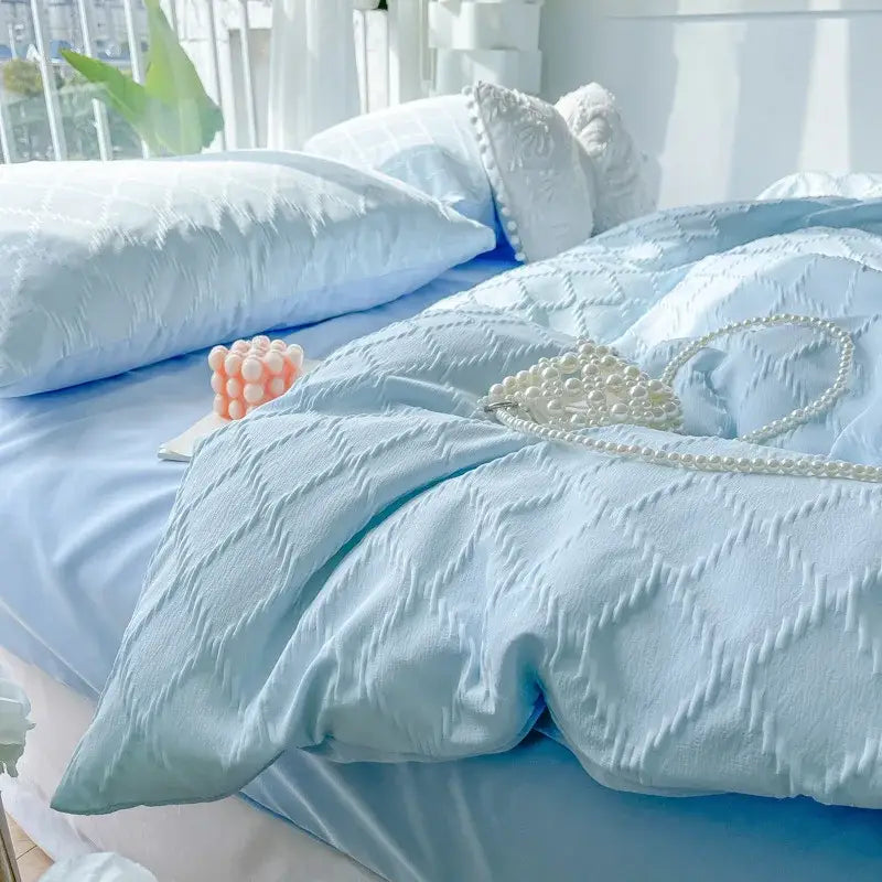 Light blue diamond grid jacquard bedding sets featuring a quilted duvet and matching pillows for bedroom comfort