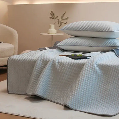Light blue quilted bedspread with gray border from decorbites ice bean bed sheet set for cooling sleep comfort