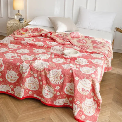 Pink cotton gauze summer blanket with white beige lucky cat pattern and red border from decorbites cotton gauze collection