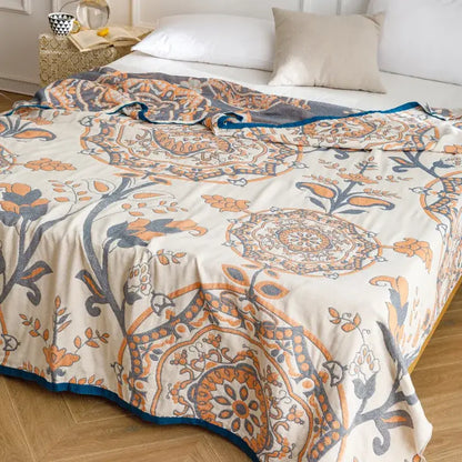Light blue and gray patterned cotton gauze summer blanket with cream floral mandala and teal border decorbites cotton gauze