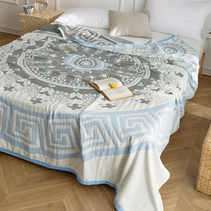 Light blue and gray patterned cotton gauze summer blanket with mandala design and geometric borders by decorbites cotton gauze