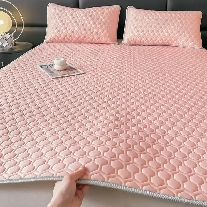 Pink hexagonal quilted bed mat with light gray border latex filled bed mat for cooling bedroom use