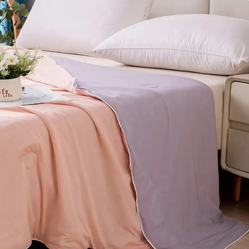 Soft lavender and peach quilted air conditioning quilt with subtle sheen for light blue ice cream air summer bedroom use