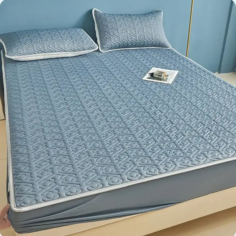 Light blue quilted latex fitted sheet set with subtle geometric pattern and white piping for bedroom bed pad