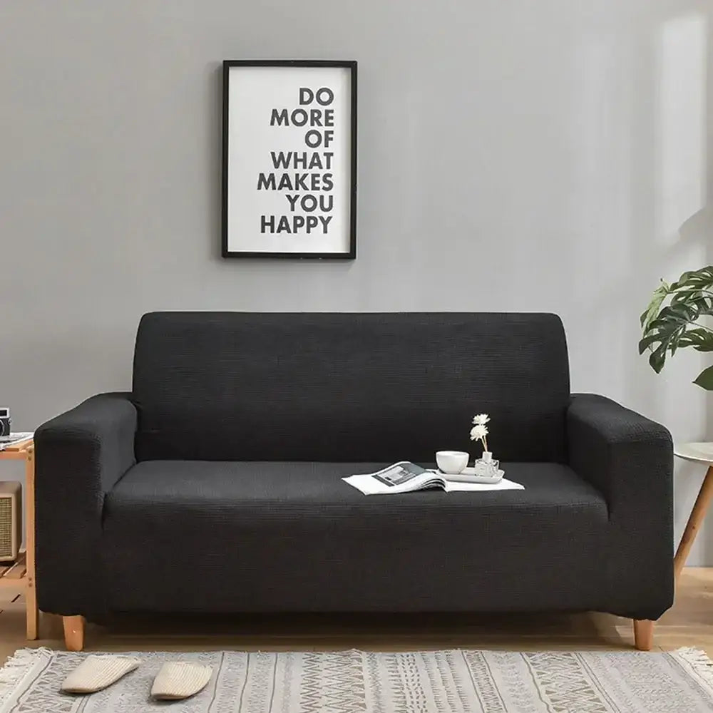 Black textured decorbites 3d quilted thicken sofa cover snugly fitted on modern loveseat with light wooden legs