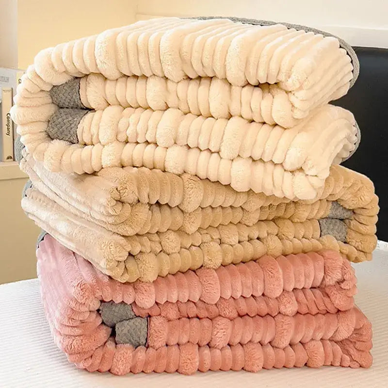 Stack of beige tan and pink decorbites cozy faux rabbit plush ribbed throw blankets for bedroom shawl use