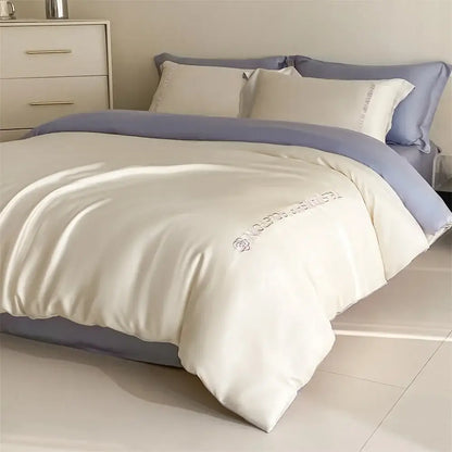 Cream-colored satin duvet cover with lavender trim and floral embroidery in light blue satin cotton embroidery bedding set