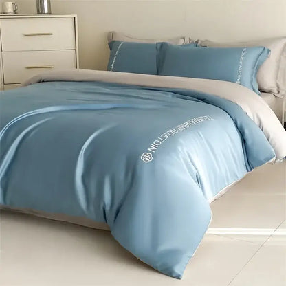 Light blue satin cotton embroidery bedding set with white embroidered text and logo for bedroom decorbites cotton embroidery