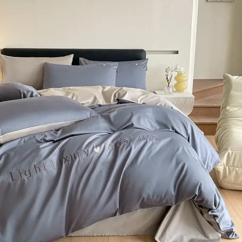 Light blue satin embroidery bedding set with soft gray duvet cover featuring light luxury ideal life embroidery