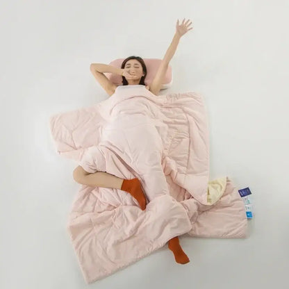 Soft pink quilted blanket with plush texture and subtle stitching details for decorbites cooling fabric summer comforter
