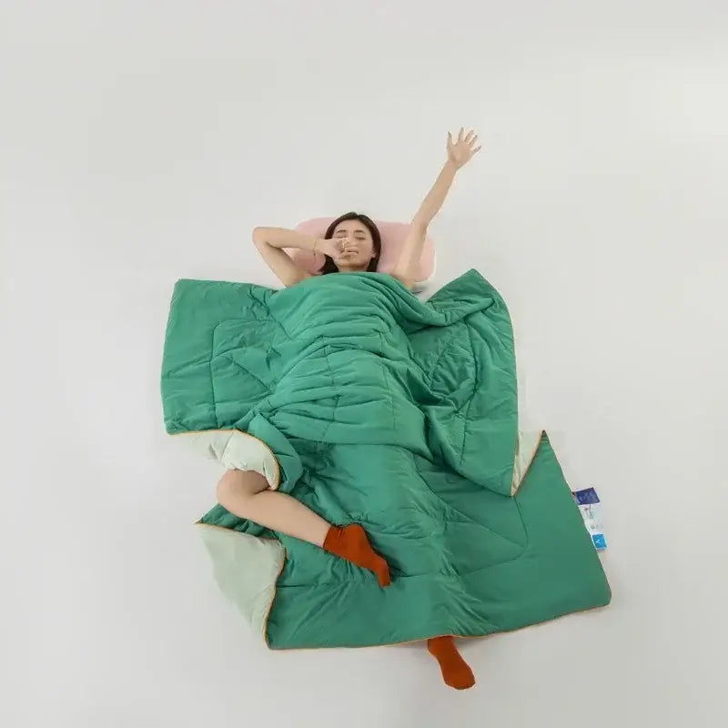 Emerald green quilted sleeping bag with light mint inner lining made of decorbites cooling fabric for summer comfort