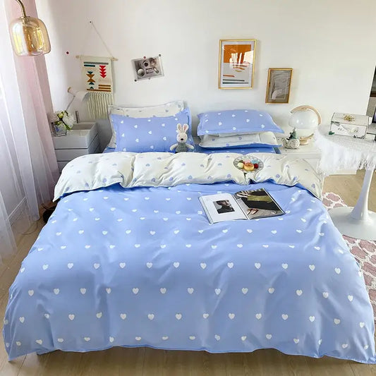 Light blue and white heart print bedding set featuring a duvet cover with a light blue solid color and heart patterns