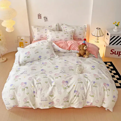 Pastel floral and bear-patterned white bedding set with soft pink inner lining complements light blue and white heart print design