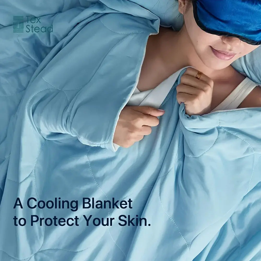 Light blue and white quilted cooling comforter with smooth texture and subtle stitching ideal for hot sleepers decorbites