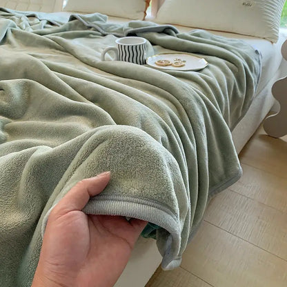 A soft sage green coral velvet summer blanket with plush texture and neatly finished edges by decorbites coral velvet