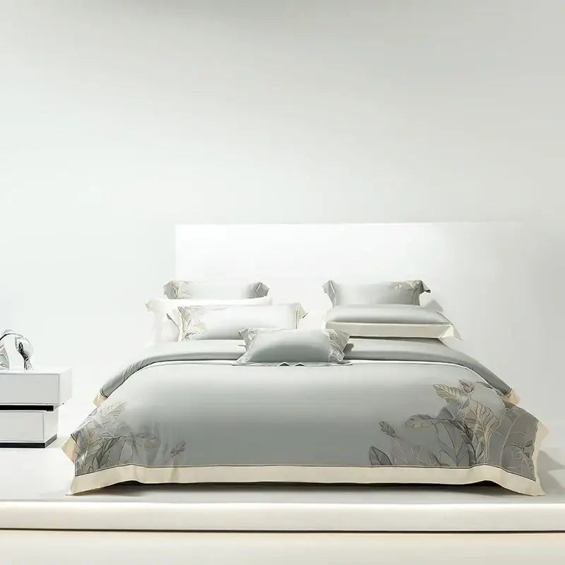 Light gray eucalyptus lyocell soft bedding set with delicate leaf embroidery and cream-colored piping by decorbites eucalyptus lyocell