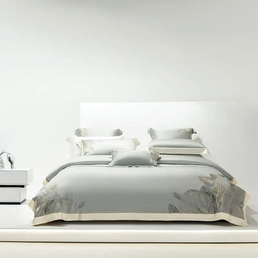 Light gray eucalyptus lyocell soft bedding set with delicate leaf embroidery and cream-colored piping for bedroom decor