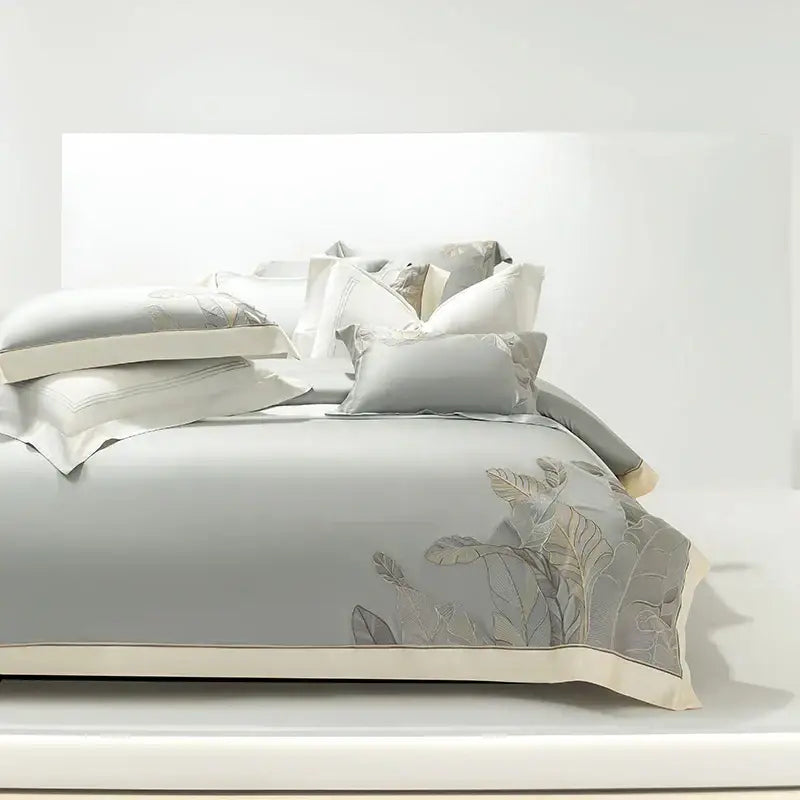 Light gray eucalyptus lyocell soft bedding set with delicate silver leaf embroidery and cream piping by decorbites eucalyptus lyocell