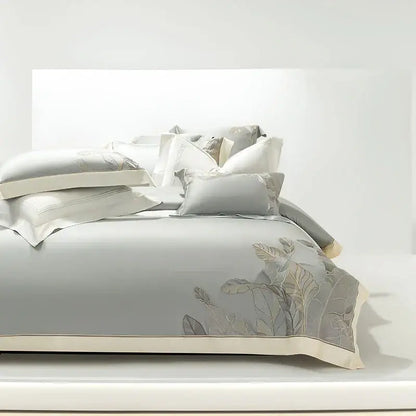 Light gray eucalyptus lyocell soft bedding set with delicate silver leaf embroidery and cream piping by decorbites eucalyptus lyocell