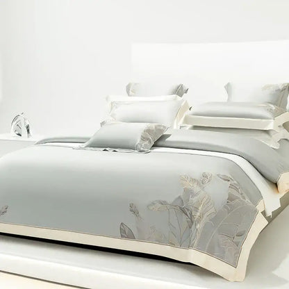 Light gray eucalyptus lyocell soft bedding set with delicate leaf embroidery and cream-colored border for bedroom decor