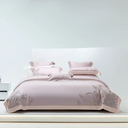 A soft blush pink satin bedding set with elegant leaf embroidery featuring decorbites eucalyptus lyocell soft fabric
