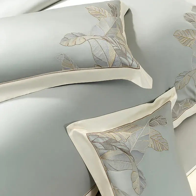 Light blue satin pillowcases with silver and beige leaf embroidery from decorbites eucalyptus lyocell soft bedding set