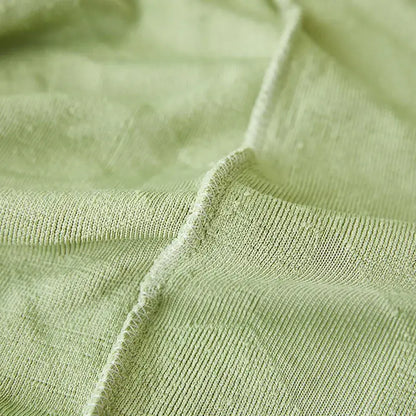 Light green hexagonal quilted jacquard sofa seat cover with soft mint green knitted ribbed texture for decorbites jacquard sofa