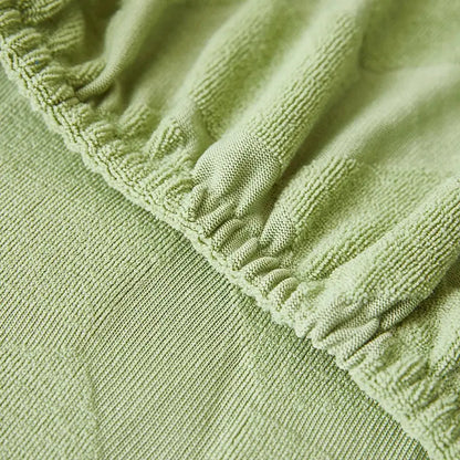 Light green hexagonal quilted jacquard sofa seat cover with ribbed elasticated edge for decorbites jacquard sofa