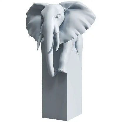 Gray elephant sculpture with detailed features and large ears on matching pedestal for decorbites elephant ornaments decor