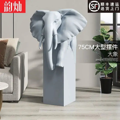 A sleek 75cm tall gray elephant sculpture with detailed features on a matching pedestal decorbites elephant ornaments