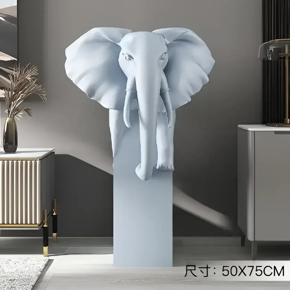 A sleek light blue glossy elephant ornament sculpture with oversized ears on a matching pedestal for living room decorbites elephant ornaments