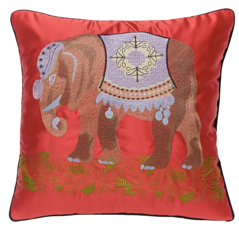 A vibrant red satin elephant embroidery sofa cushion cover with intricate purple and gold decorbites elephant embroidery