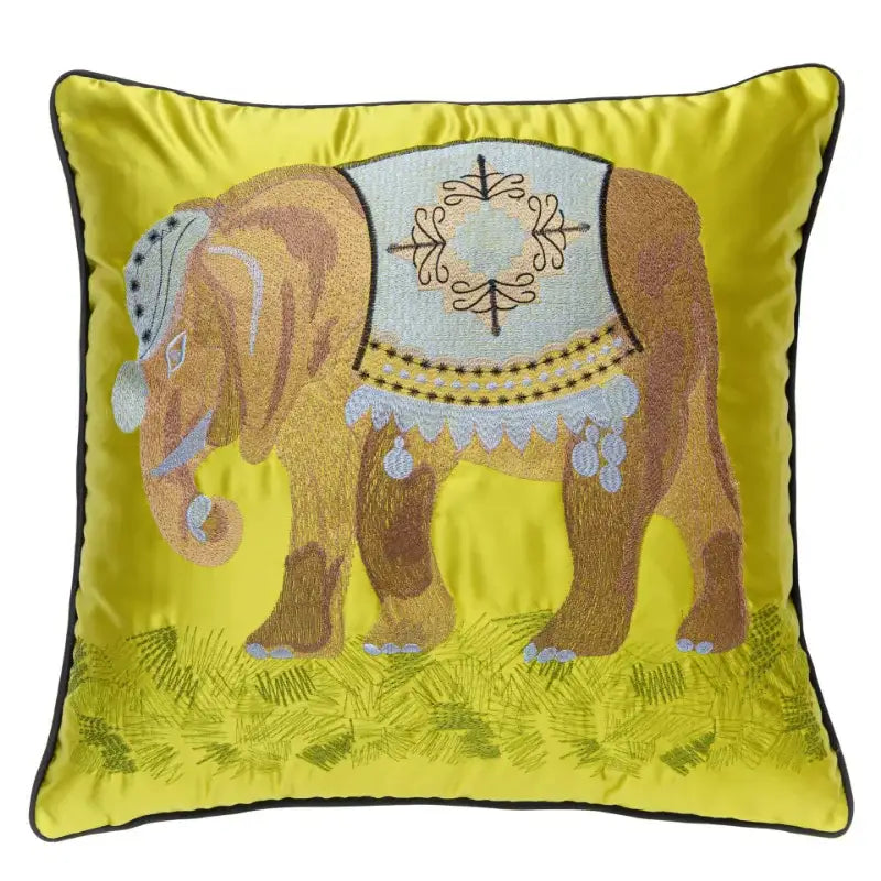 Vibrant yellow satin cushion cover with intricate brown elephant embroidery and light blue harness for decorbites elephant embroidery sofa