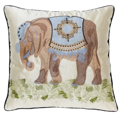 Cream-colored cushion cover with decorbites elephant embroidery in brown and blue on green grass for sofa decorbites elephant embroidery